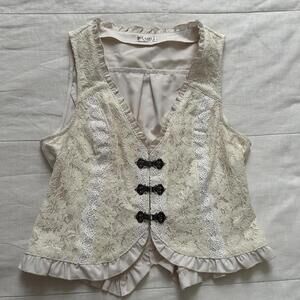 Axes Femme cream lace vest with ruffles and hook detail front